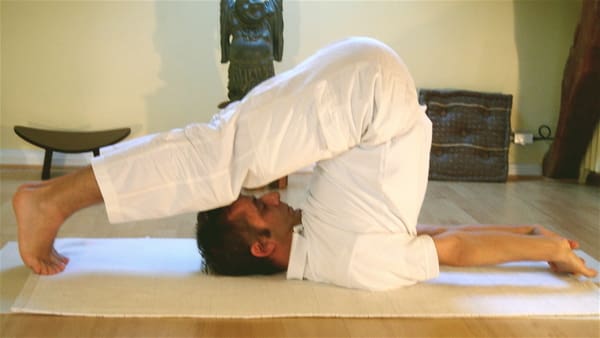 Halasana - 10 Yoga Poses That Aid in Addiction Recovery