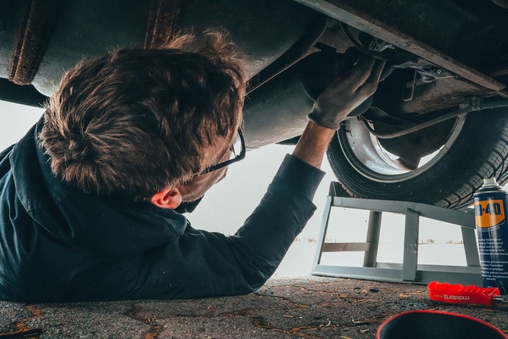 Mechanic fixing car 1024x683 - Top Reasons Why Using Quality Used Car Parts Is An Efficient Decision