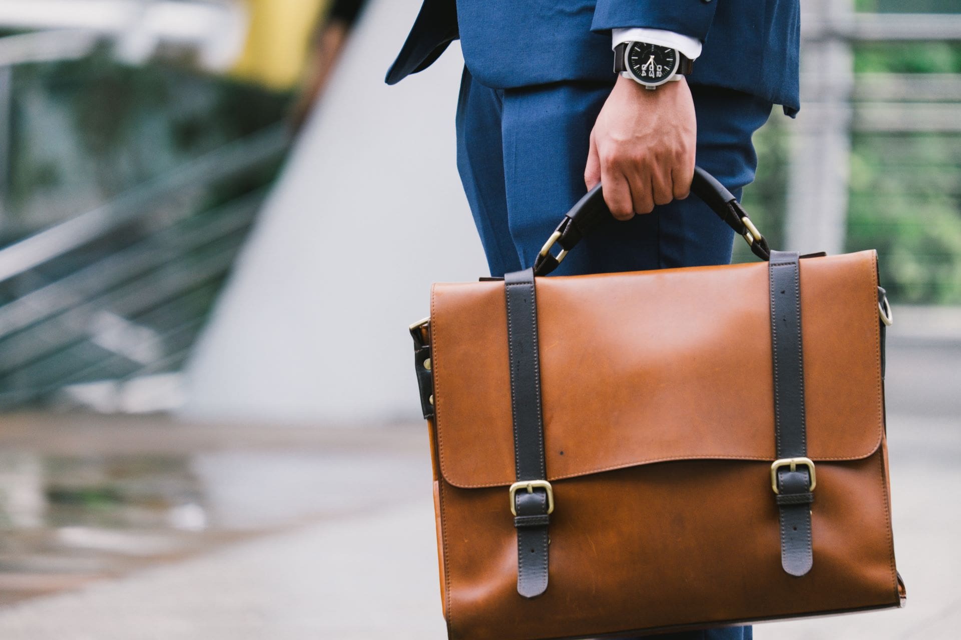 Brown briefcase with black straps